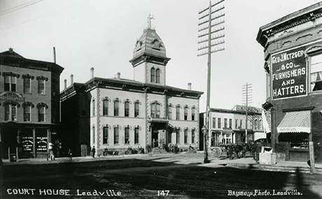 West side of 500 Block, Harrison Avenue. Baer Brothers at left.