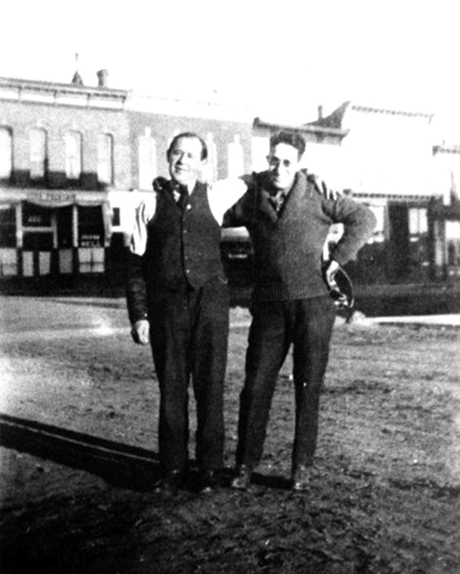Hyman’s son Louis Isaacs and store manager Mike Philips outside the store at 301 Harrison in 1914..