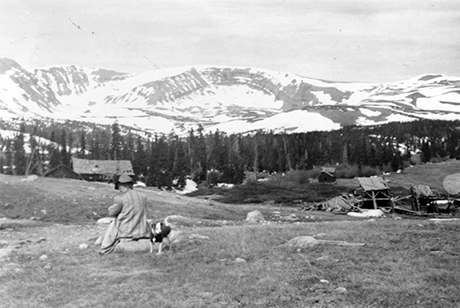 Muriel Sibell Wolle and her dog Chipper overlooking the remnants of the town of Leavick. Date unknown.