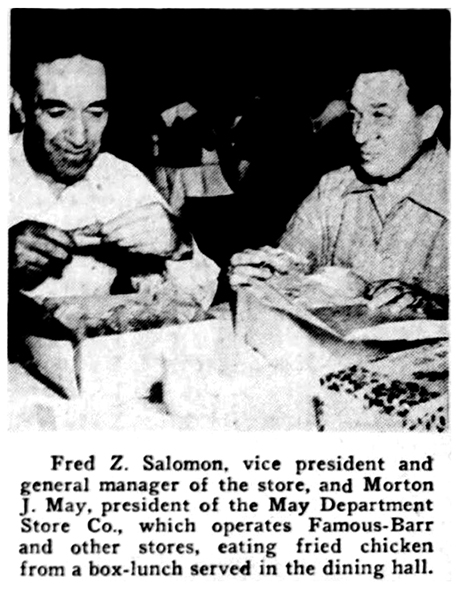 Photo article showing Fred Z. Salomon and Morton J. May “eating fried chicken from a box-lunch served in the dining hall”.