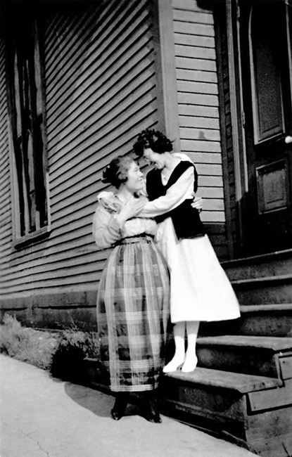 Two ladies are standing in front of the Kneseth Israel synagogue. These ladies are possibly the daughters of Hyman Isaacs.